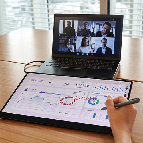 person having an online meeting while drawing on a Ricoh portable monitor