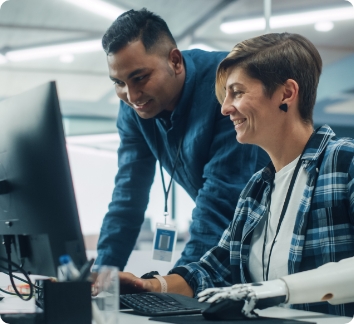 two people working on a computer